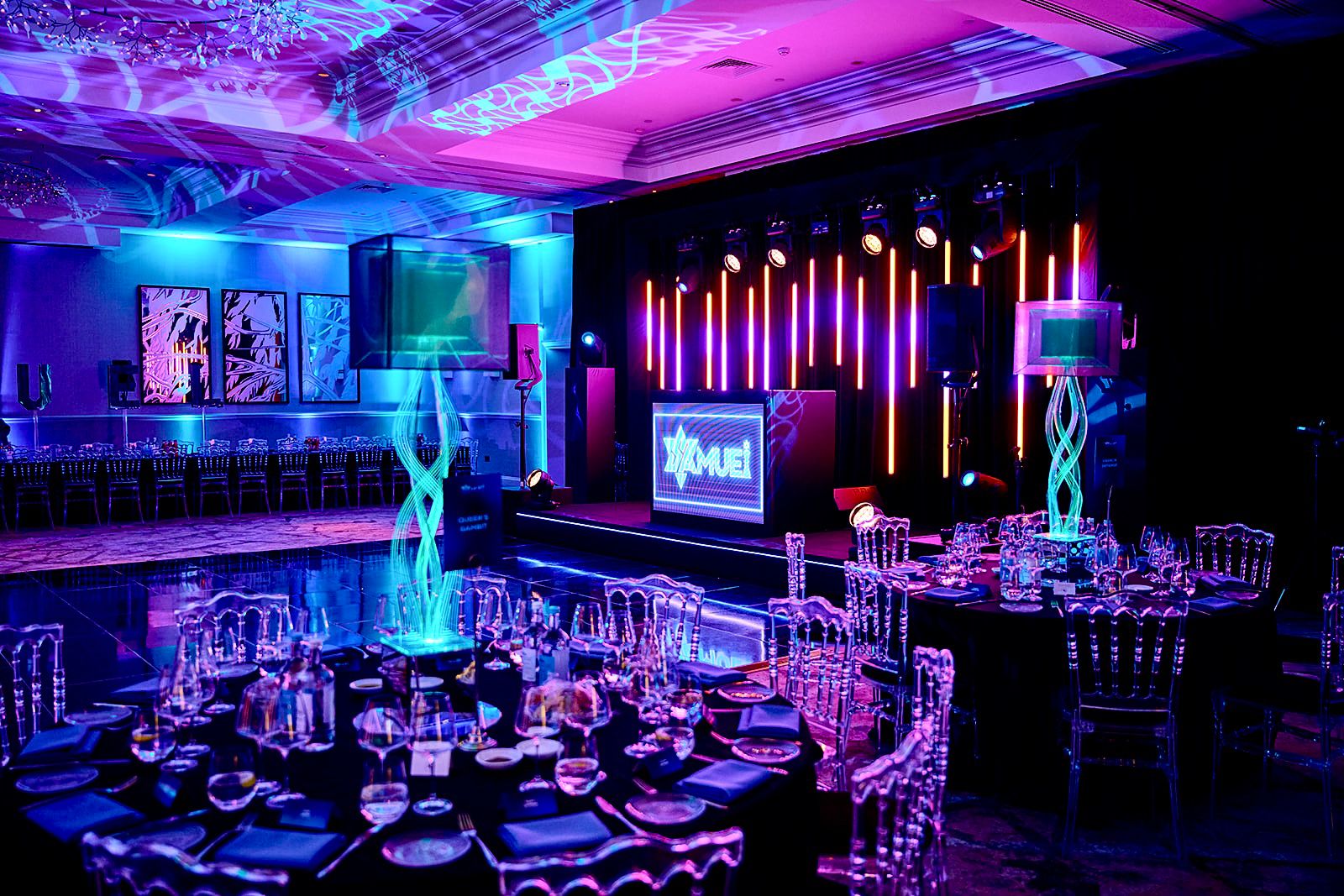 Personalised stage and illuminated table centres for a 9 Events celebration