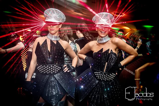 Entertainers in mirrored hats bringing energy to the celebration