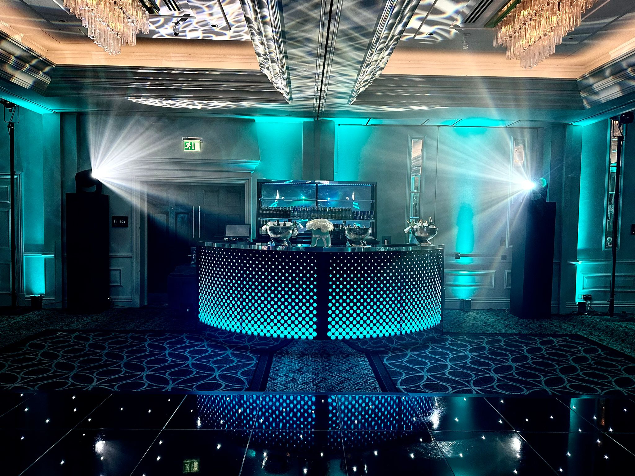 An illuminated circular bar and atmospheric event lighting