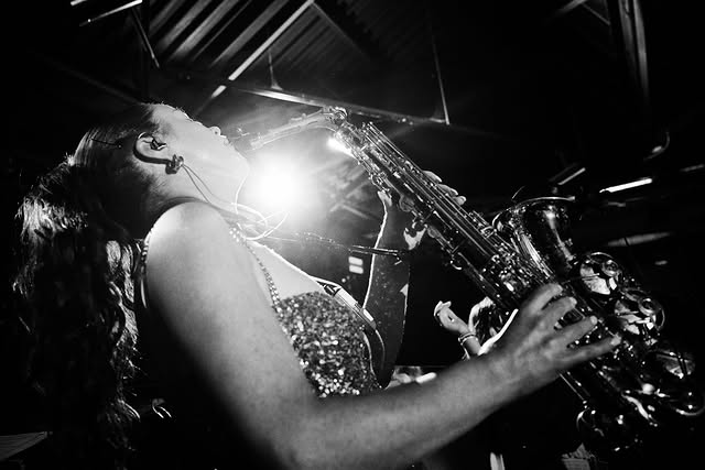 A saxophonist performing live at a 9 Events celebration